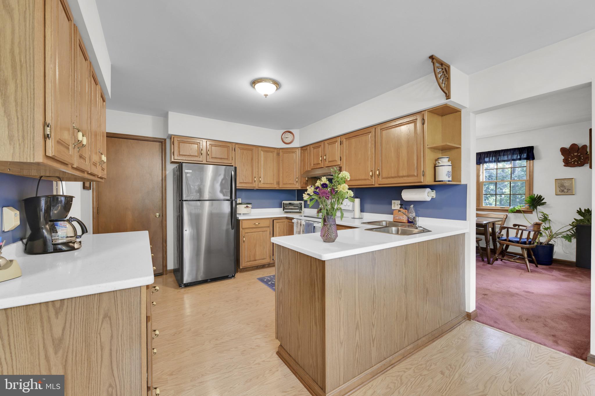 400 Reitnour Road Spring City, PA 19475 - Photo 8 of 52 a kitchen with refrigerator a sink and a stove