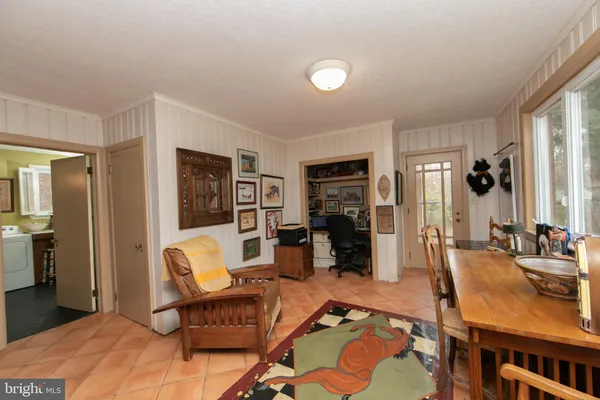 a view of washer and dryer with kitchen view