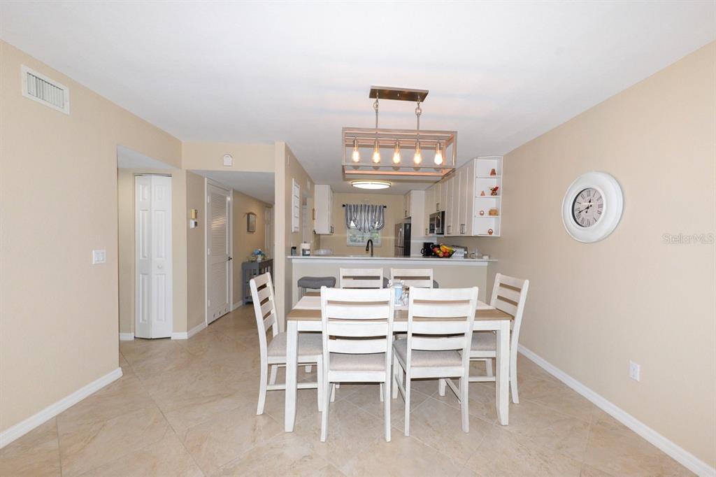 175 Kings Highway, Unit A7 Punta Gorda, FL 33983 - Photo 13 of 36 a view of a dining room with furniture
