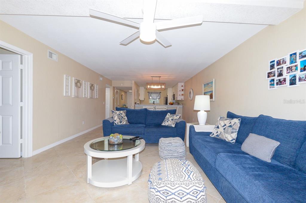 175 Kings Highway, Unit A7 Punta Gorda, FL 33983 - Photo 16 of 36 a living room with furniture and a rug