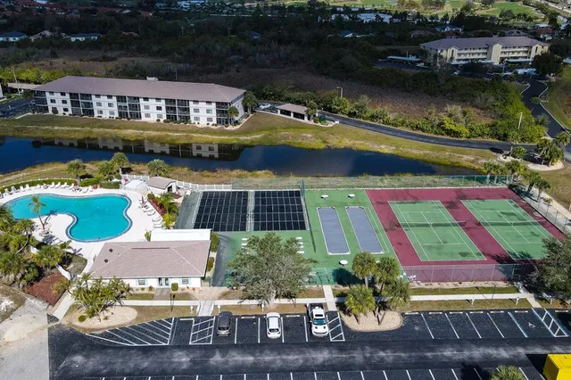 an aerial view of a house with lake view