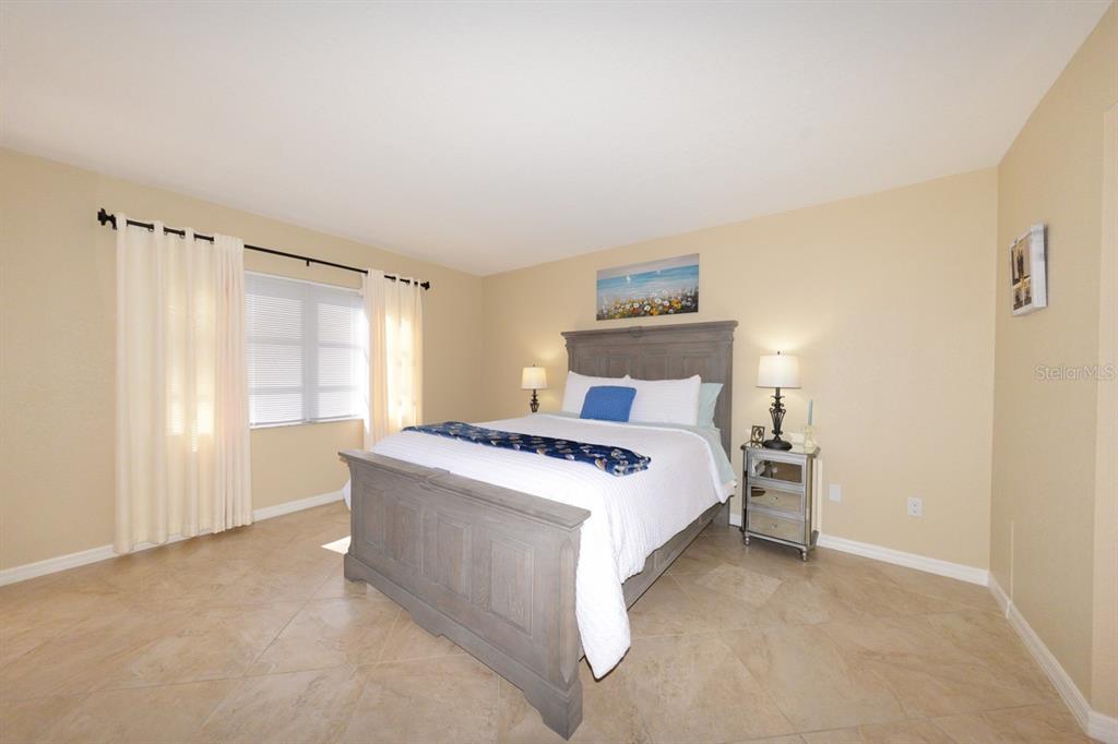 175 Kings Highway, Unit A7 Punta Gorda, FL 33983 - Photo 24 of 36 a bedroom with a bed and a window
