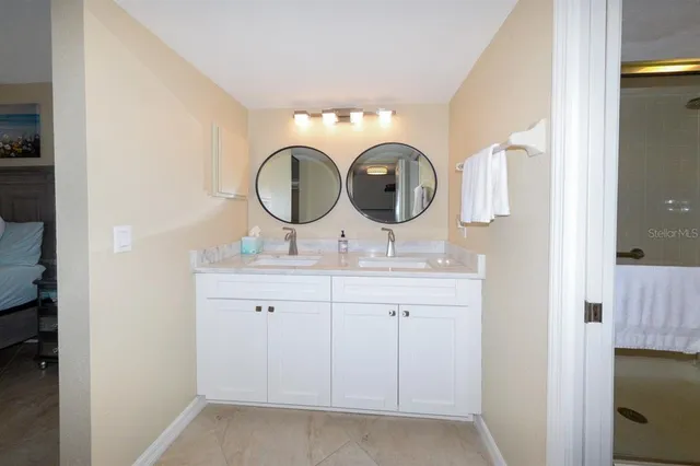 a bathroom with a sink and a mirror