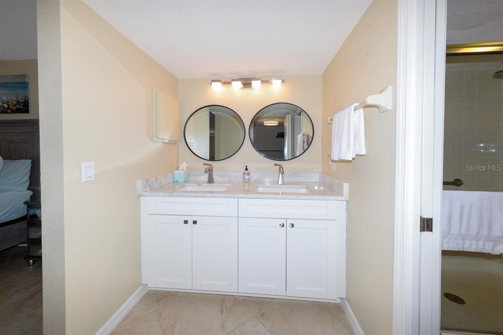 175 Kings Highway, Unit A7 Punta Gorda, FL 33983 - Photo 27 of 36 a bathroom with a sink and a mirror