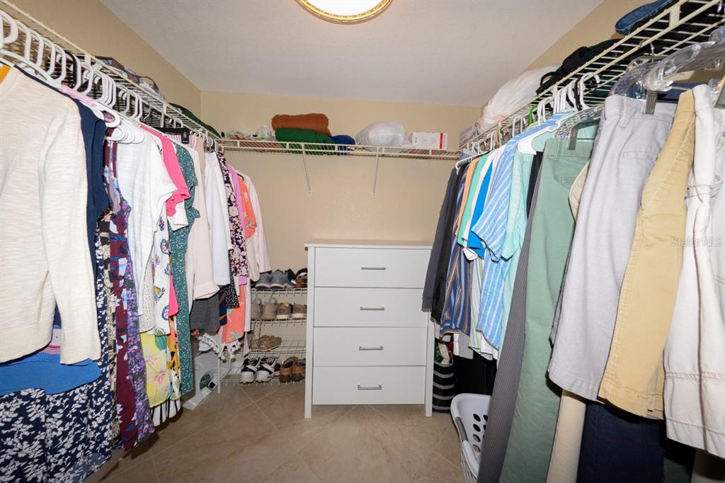 175 Kings Highway, Unit A7 Punta Gorda, FL 33983 - Photo 29 of 36 a view of walk in closet with clothes and shoes