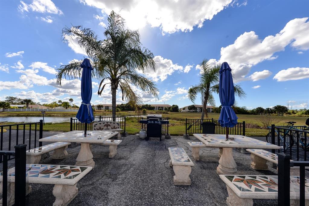 175 Kings Highway, Unit A7 Punta Gorda, FL 33983 - Photo 35 of 36 a view of a lake with couches and city view