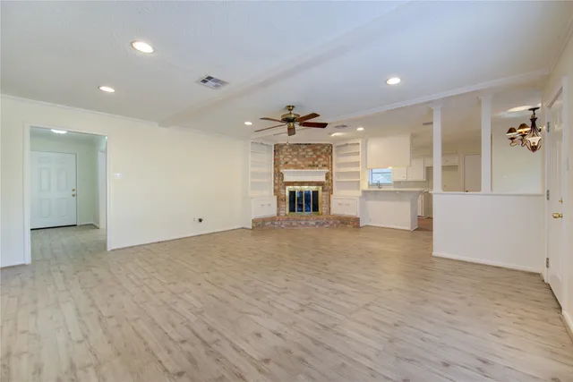 a view of a kitchen with a sink and a refrigerator