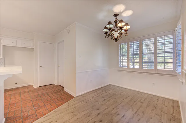 a view of a bedroom with a chandelier