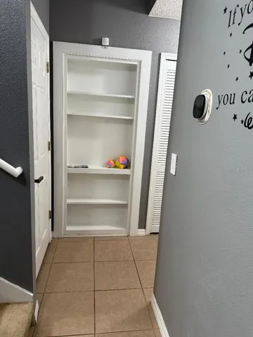 a room with furniture a flat screen tv and a fireplace