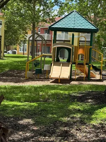 a view of a swimming pool with chairs