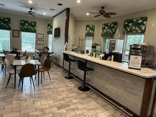 a view of a swimming pool with a table and chairs