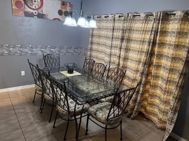a view of a dining room with furniture and chandelier kitchen