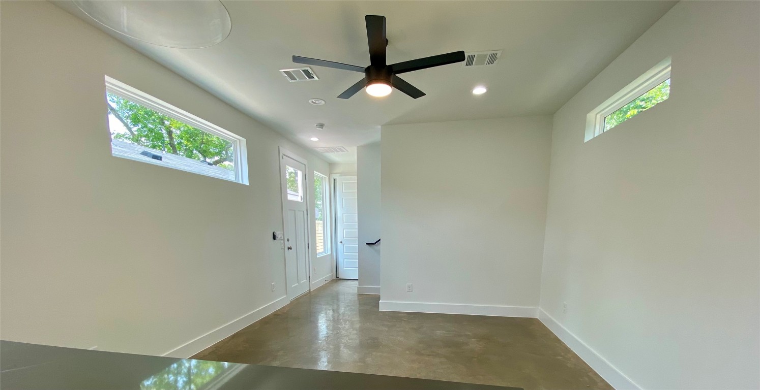 2500 Sweeney Lane, Unit B BACK HOUSE Austin, TX 78723 - Photo 6 of 17 an empty room with wooden floor and windows