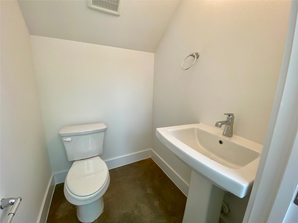 2500 Sweeney Lane, Unit B BACK HOUSE Austin, TX 78723 - Photo 9 of 17 a white toilet sitting next to a white sink