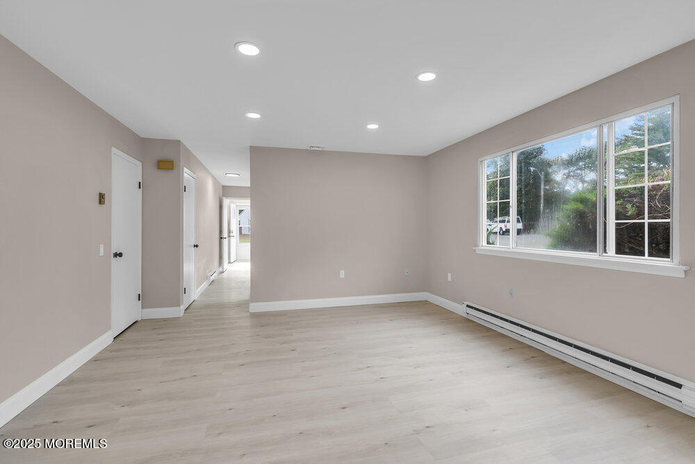9B Juniper Lane, Unit 50 Whiting, NJ 08759 - Photo 12 of 28 a view of an empty room with a window