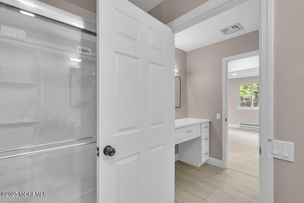 9B Juniper Lane, Unit 50 Whiting, NJ 08759 - Photo 23 of 28 a bathroom with a shower and a sink
