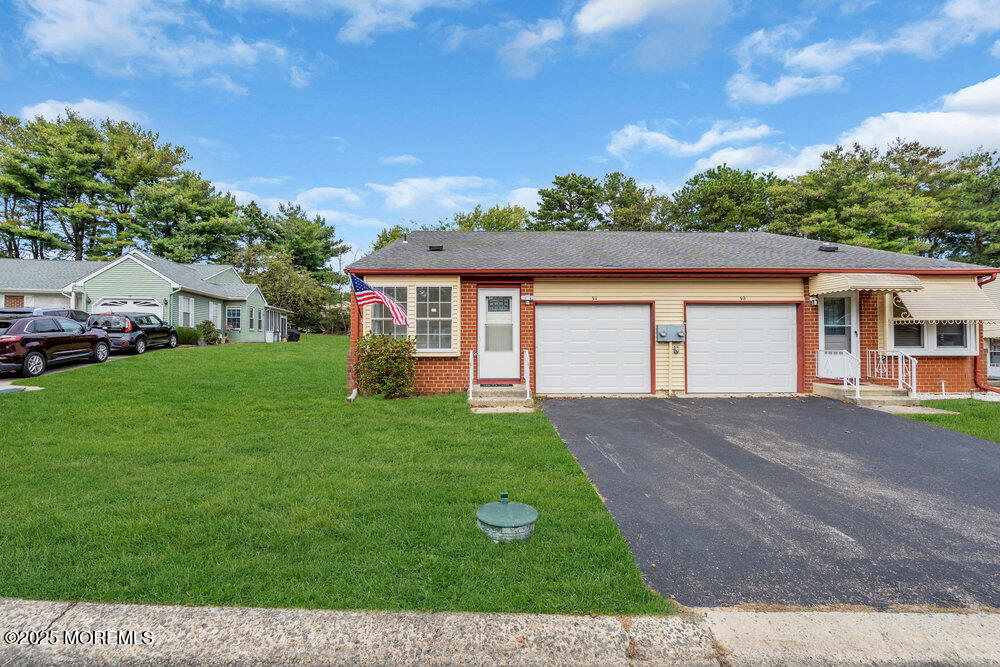 9B Juniper Lane, Unit 50 Whiting, NJ 08759 - Photo 5 of 28 a front view of a house with a yard