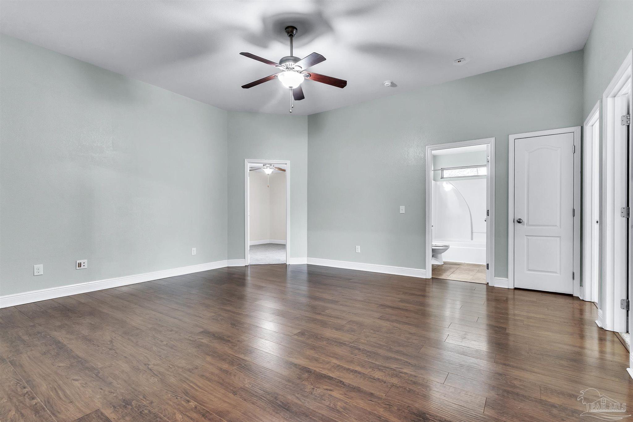 6129 Stonechase Boulevard Pace, FL 32571 - Photo 18 of 57 a view of an empty room with wooden floor