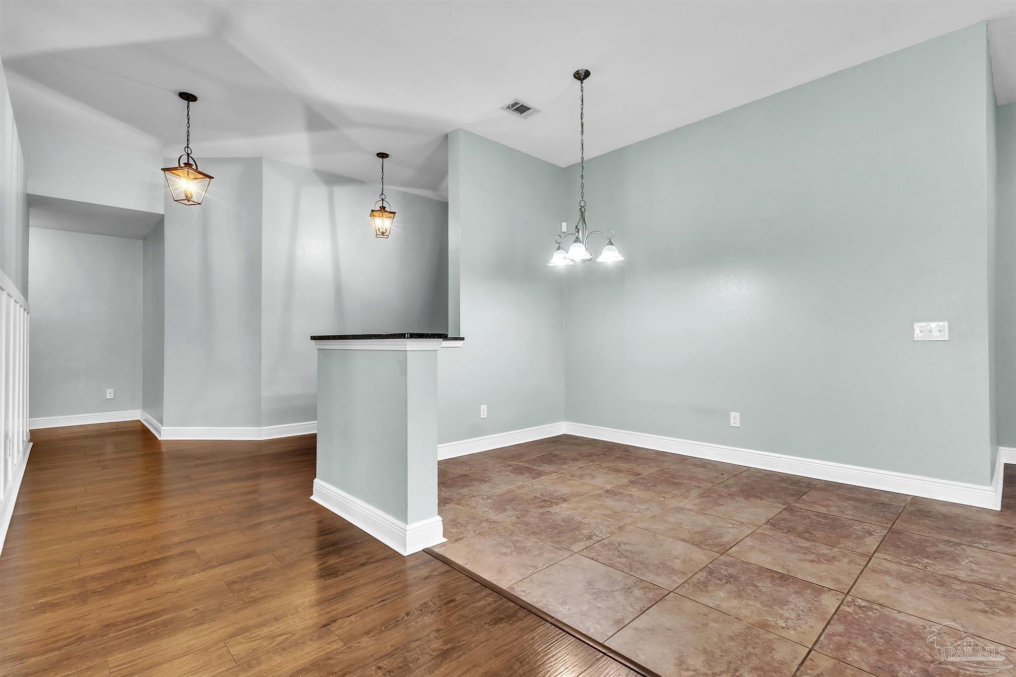 6129 Stonechase Boulevard Pace, FL 32571 - Photo 38 of 57 an empty room with wooden floor and electric appliances