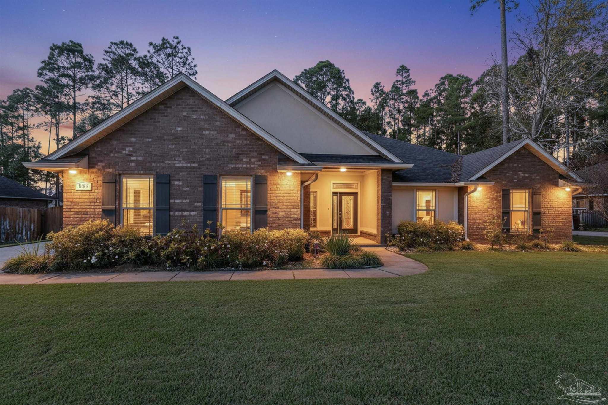 6129 Stonechase Boulevard Pace, FL 32571 - Photo 5 of 57 a front view of a house with a yard