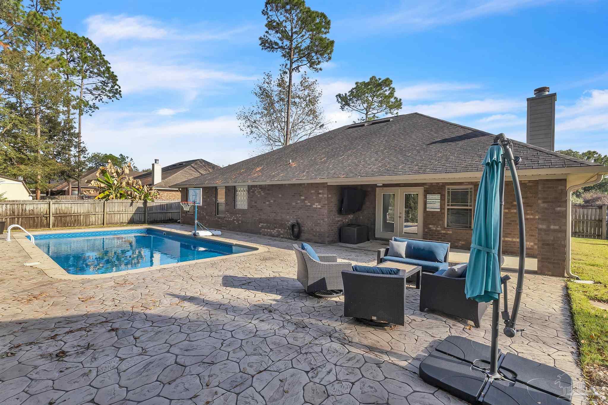 6129 Stonechase Boulevard Pace, FL 32571 - Photo 54 of 57 a view of a house with backyard porch and sitting area