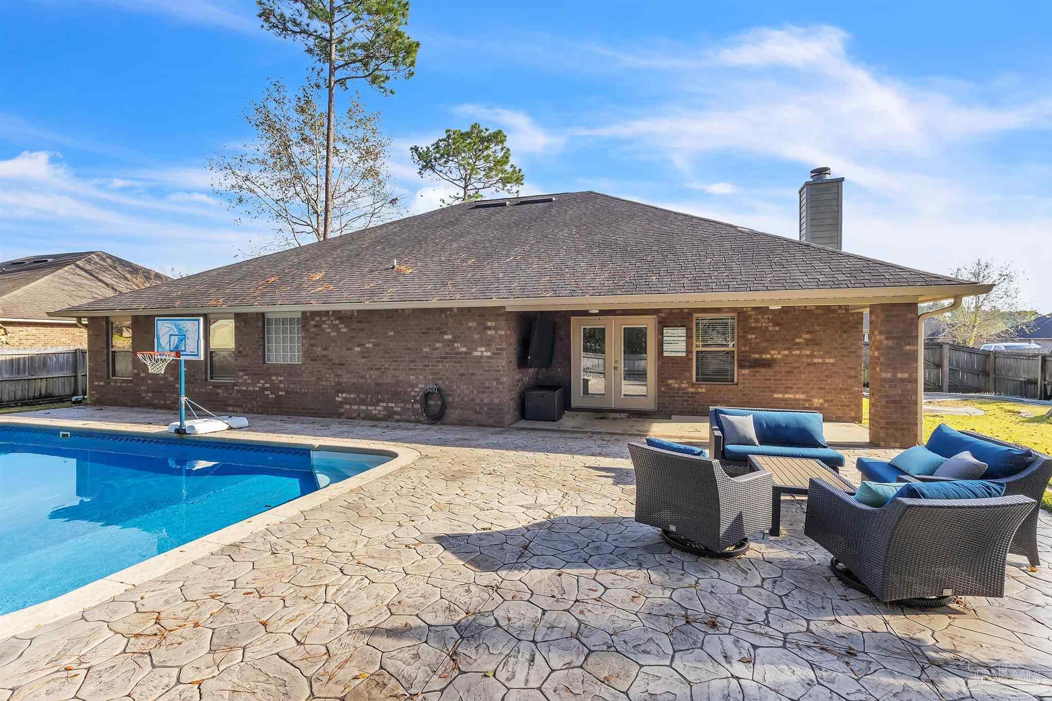 6129 Stonechase Boulevard Pace, FL 32571 - Photo 55 of 57 a view of a house with swimming pool and sitting area