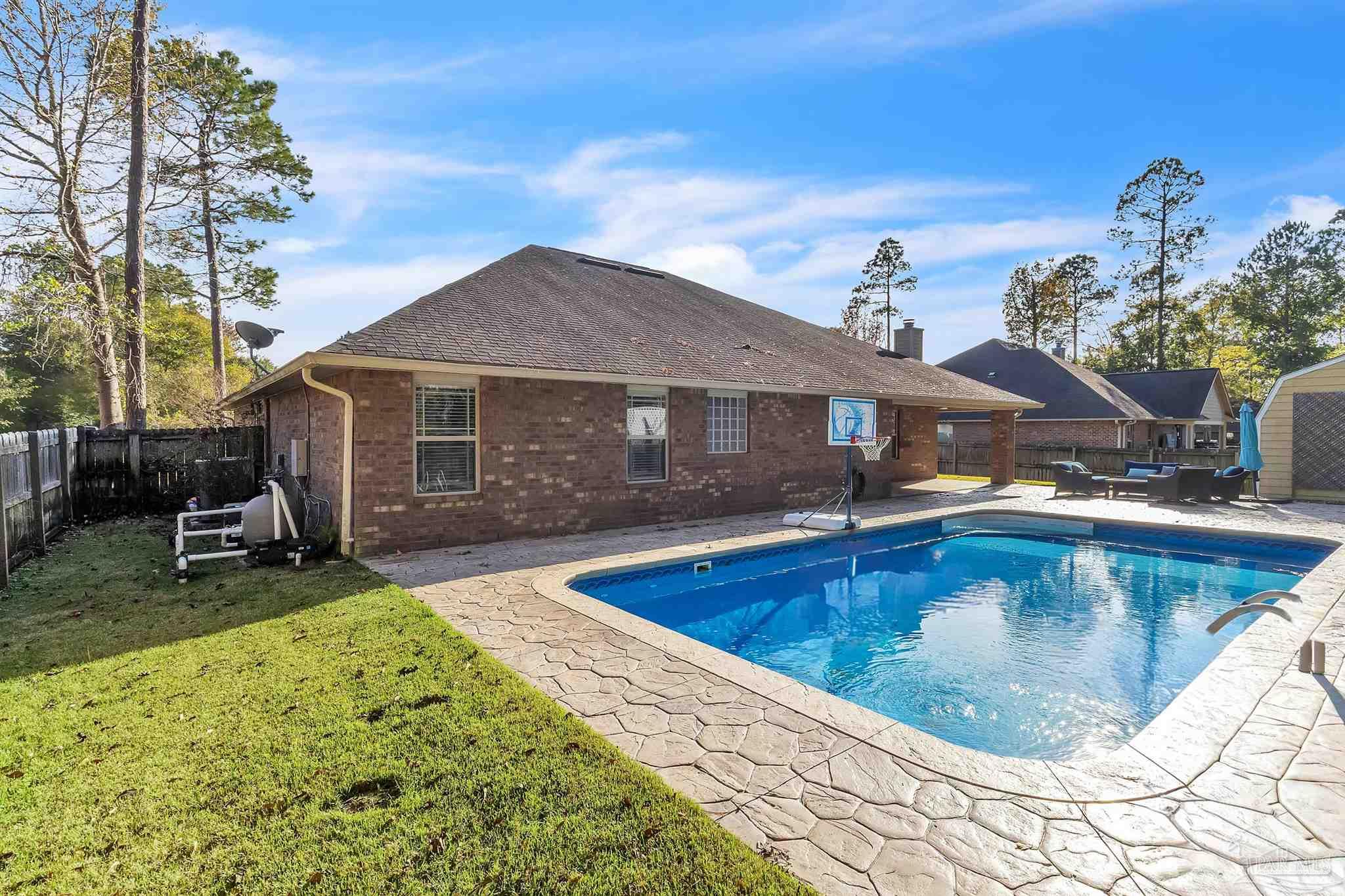 6129 Stonechase Boulevard Pace, FL 32571 - Photo 57 of 57 a view of a house with swimming pool and sitting area