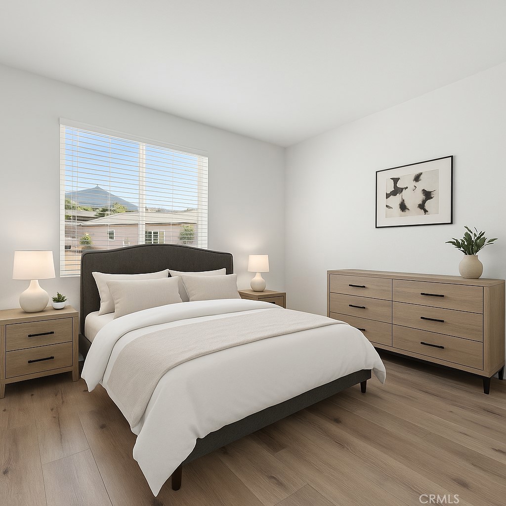 1537 Yucca Court Calimesa, CA 92320 - Photo 12 of 16 a bedroom with a bed and a window