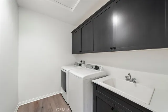 a view of bathroom with a sink and cabinets