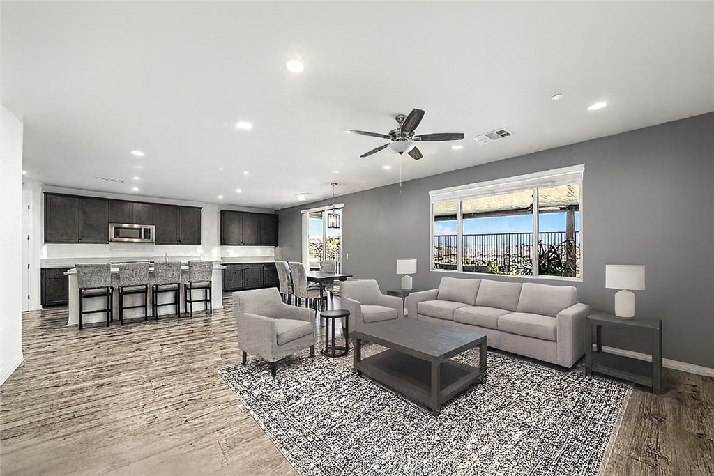 1537 Yucca Court Calimesa, CA 92320 - Photo 2 of 16 a living room with furniture and view of kitchen