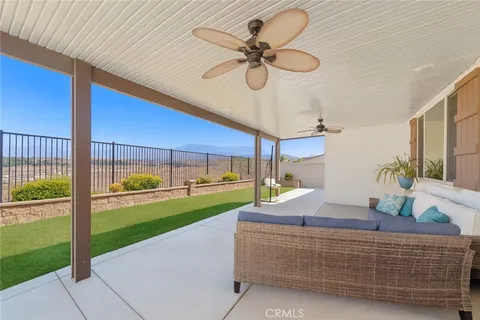 a living room with a floor to ceiling window and a table