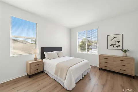 a bedroom with a bed and a dresser