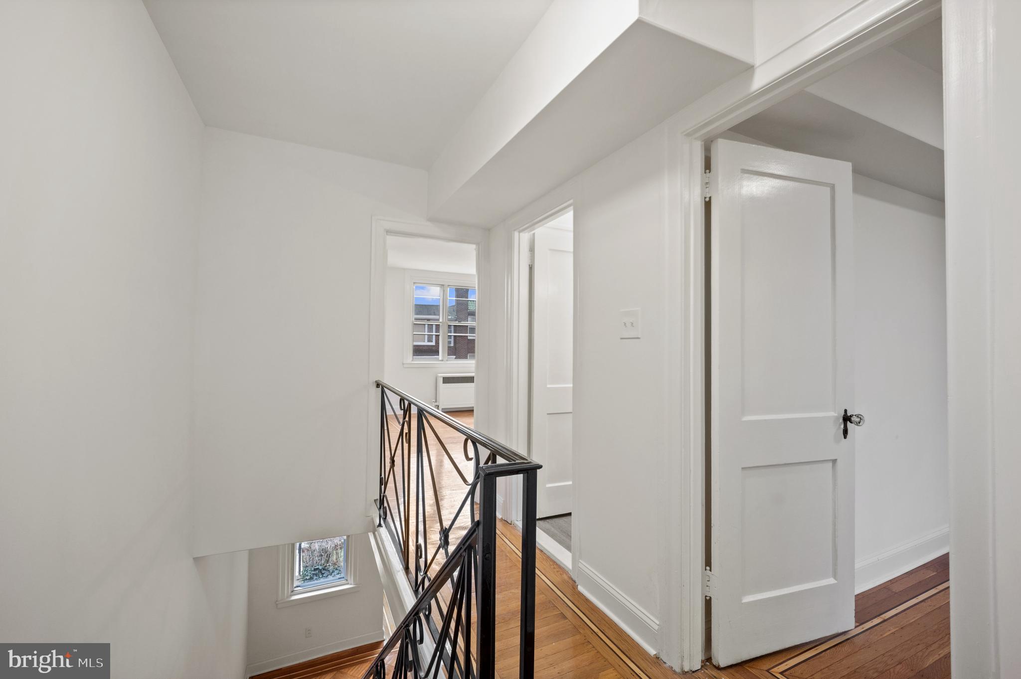 1969 Ashley Road Philadelphia, PA 19138 - Photo 5 of 12 a view of a hallway with wooden floor and staircase