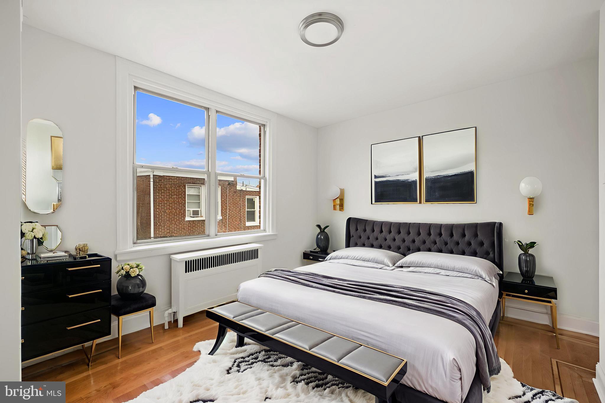 1969 Ashley Road Philadelphia, PA 19138 - Photo 7 of 12 a bedroom with a bed and wooden floor