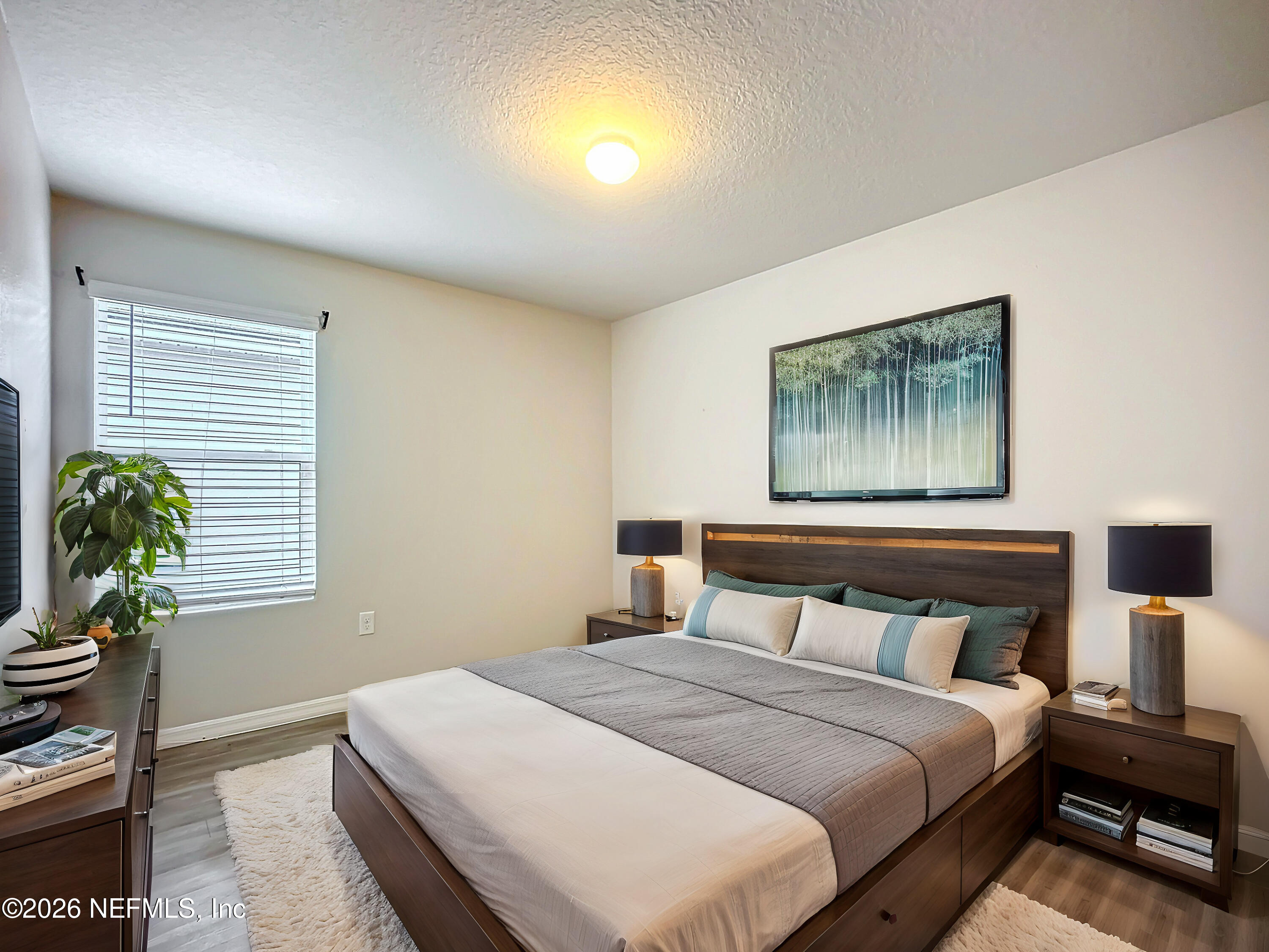 1360 Tan Tara Trail Jacksonville, FL 32221 - Photo 12 of 23 a bedroom with a bed and a painting on the wall