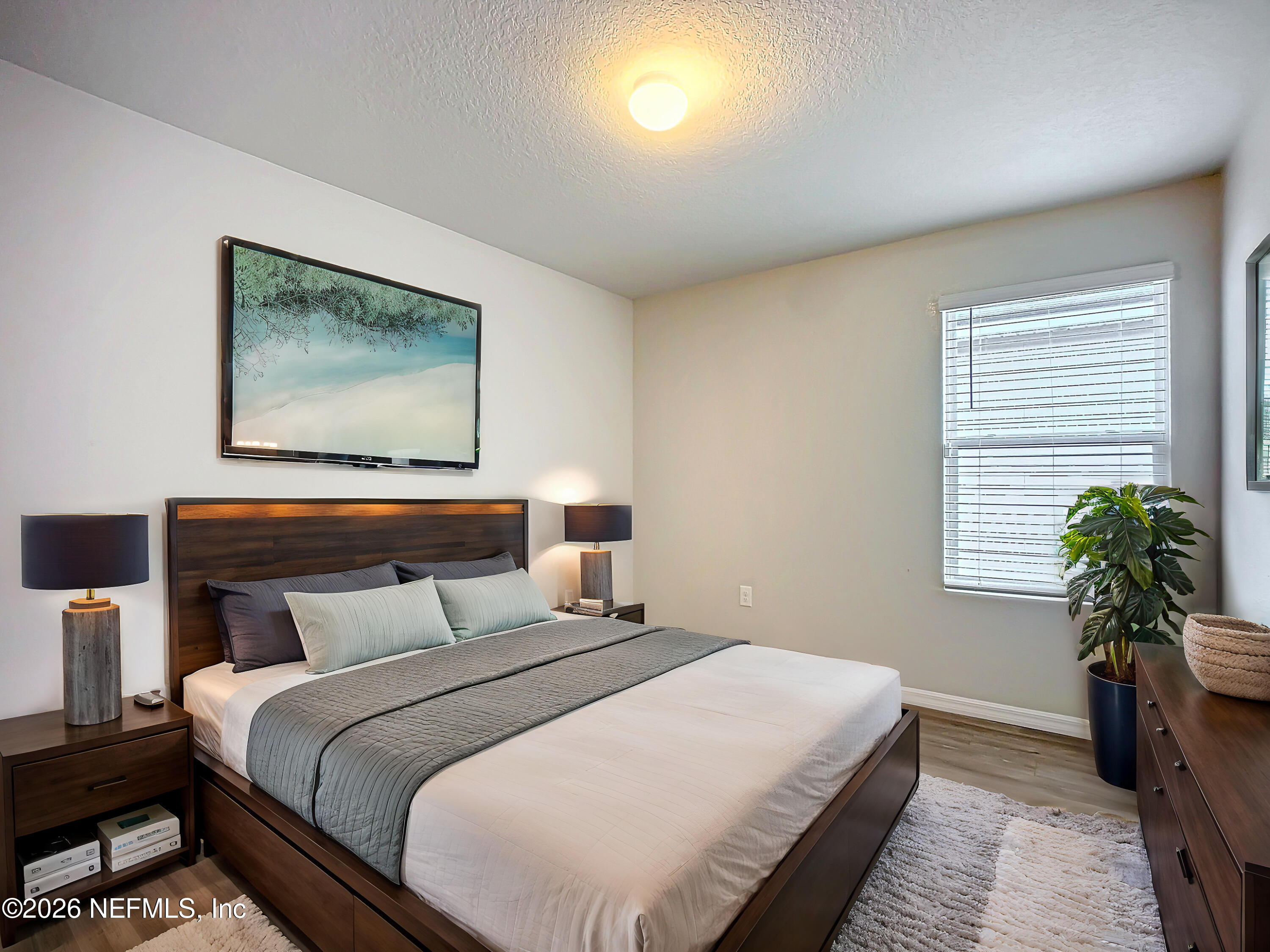 1360 Tan Tara Trail Jacksonville, FL 32221 - Photo 14 of 23 a bedroom with a bed and a potted plant