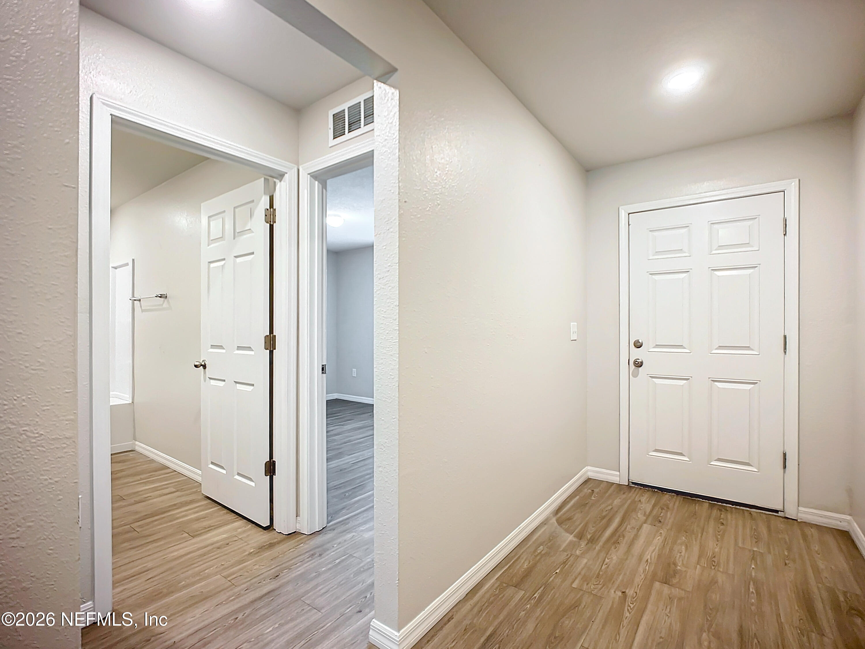 1360 Tan Tara Trail Jacksonville, FL 32221 - Photo 2 of 23 a view of a hallway with wooden floor