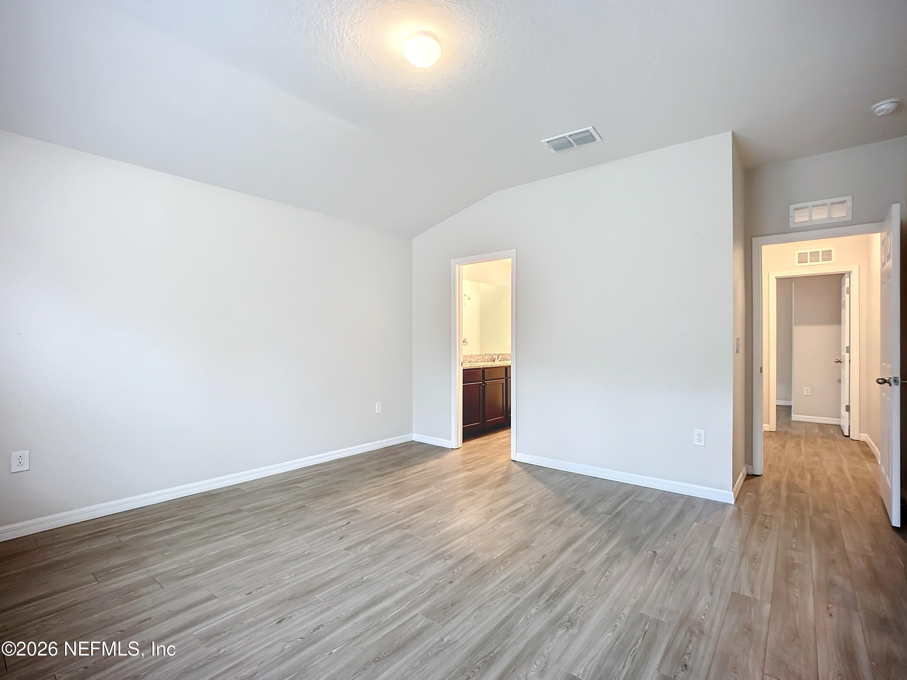 1360 Tan Tara Trail Jacksonville, FL 32221 - Photo 8 of 23 a view of an empty room with wooden floor