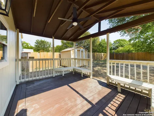 a view of a balcony with wooden floor