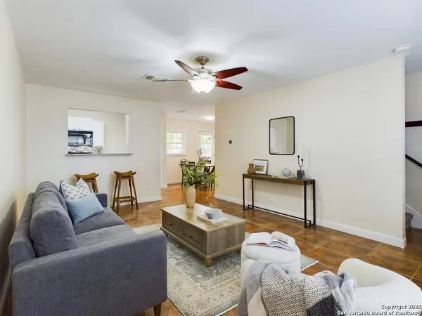 a living room with furniture and a table