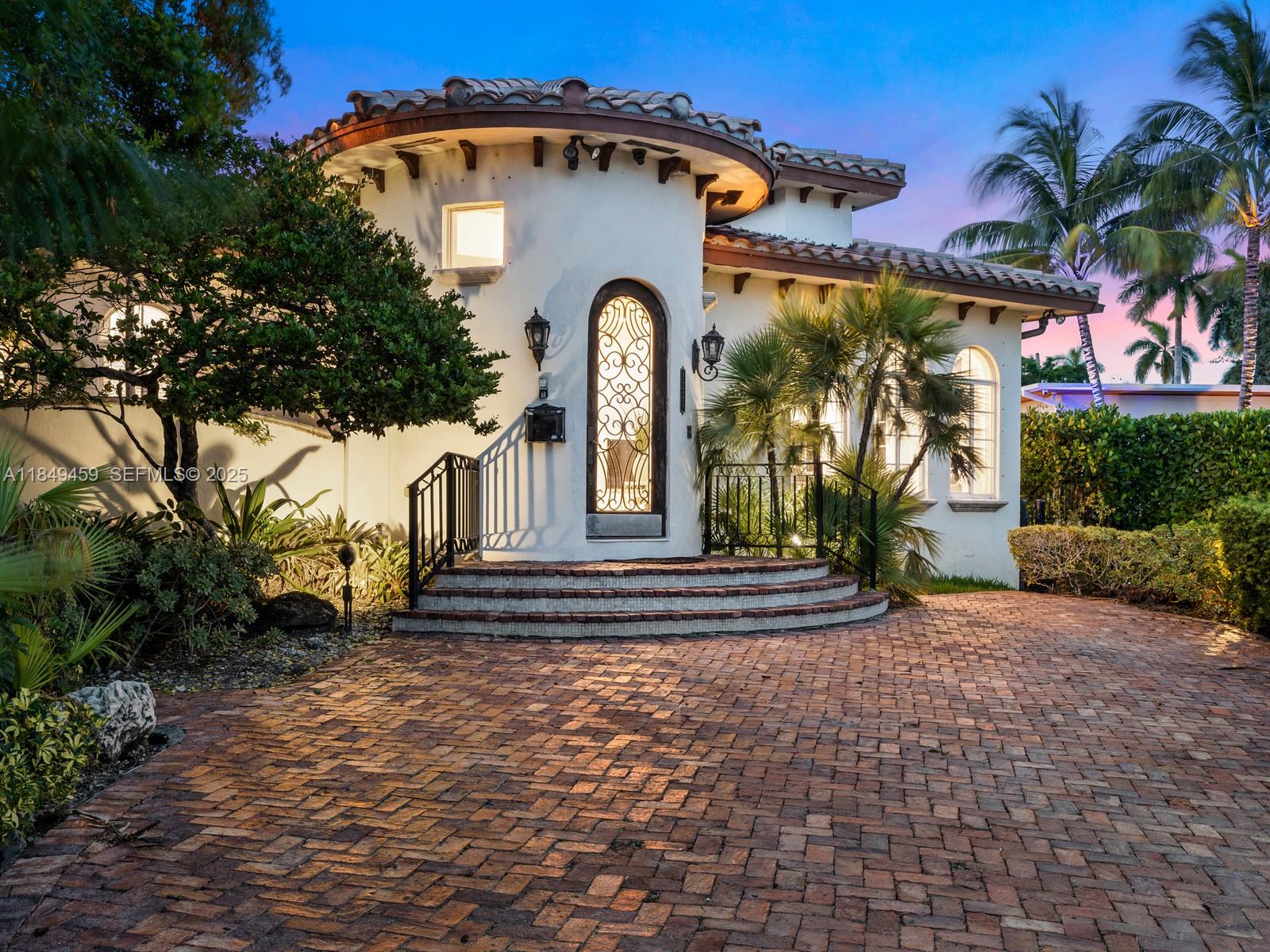 1223 Jackson Street Hollywood, FL 33019 - Photo 37 of 41 a front view of a house with garden