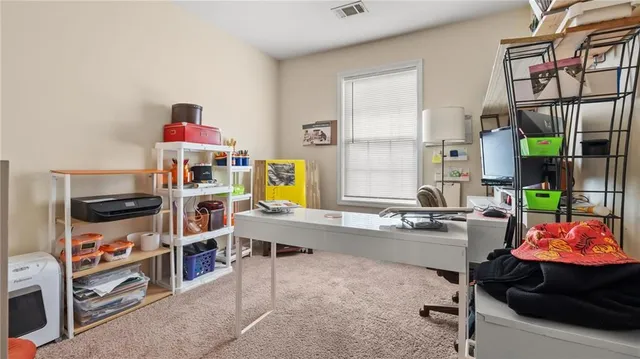 a room with furniture a rug and a window