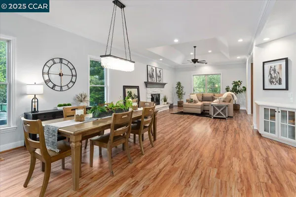 a view of a dining room with furniture window and wooden floor