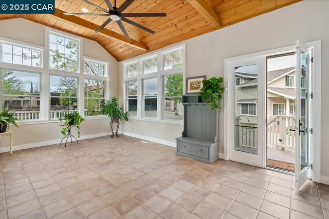 a bedroom with a bed and a potted plant