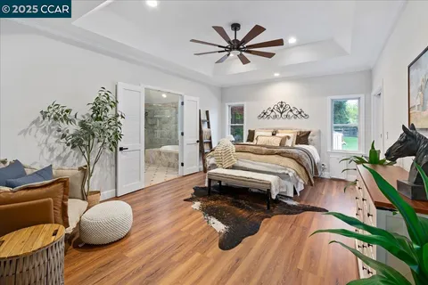 a bathroom with a double vanity sink toilet mirror and shower