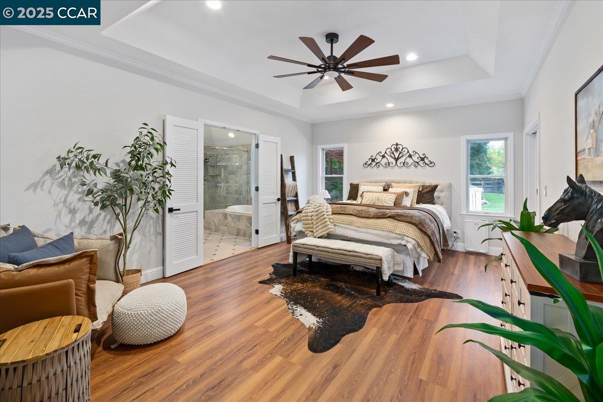 1101 North Gate Road Walnut Creek, CA 94598 - Photo 17 of 56 a bedroom with a bed and a potted plant