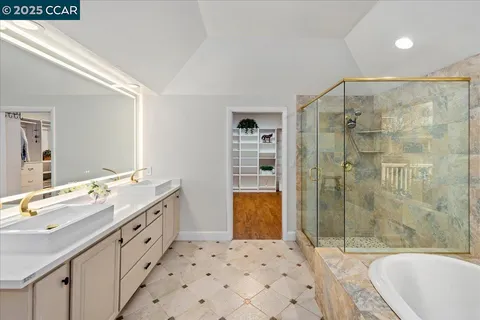 a bathroom with a tub and a shower