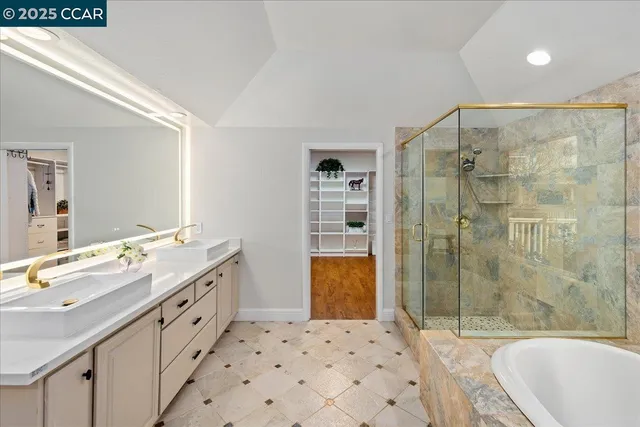 a bathroom with a tub and a shower