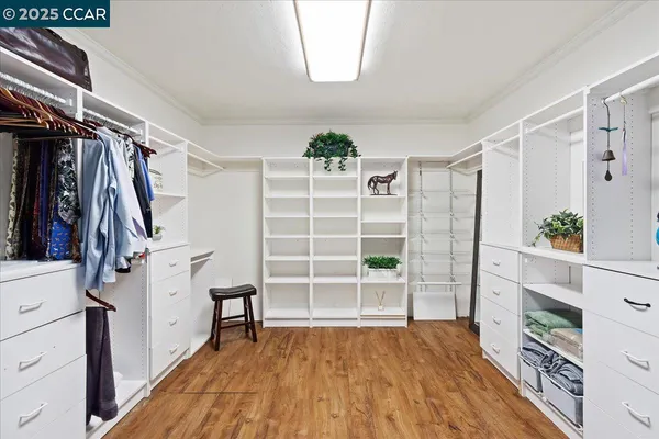 a bedroom with a large bed and a large window