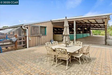 a bed room with a bed and a chair